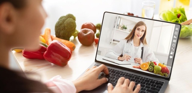 A patient consulting via laptop video feed for a remote naturopathic nutrition essex online telehealth appointment